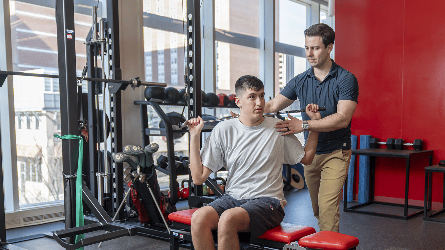 Dr. McGuinness working with a patient for sports performance assistance.