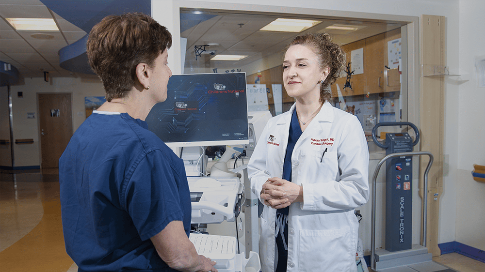 Two provider standing in the hallway talking
