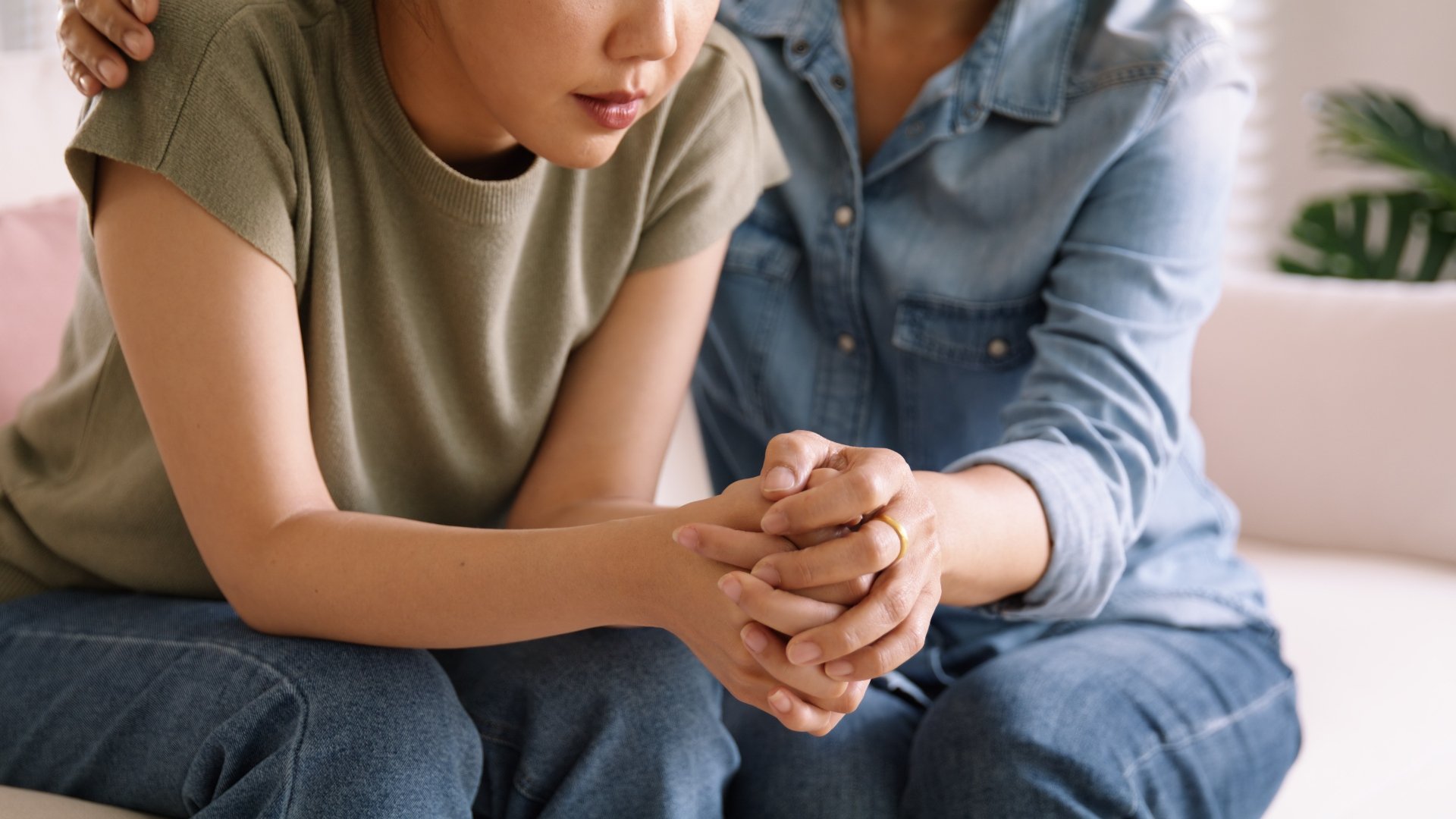 mom comforts sad teen