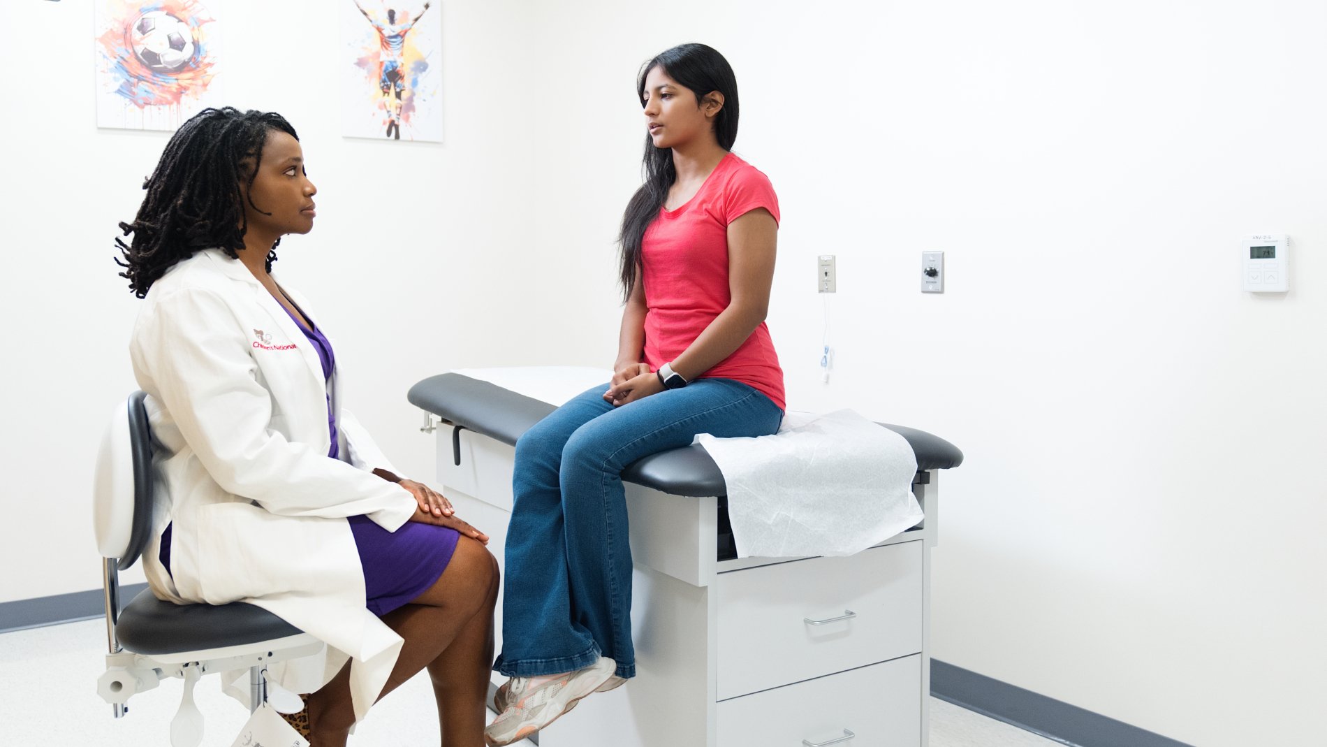 Doctor consultation with teen girl