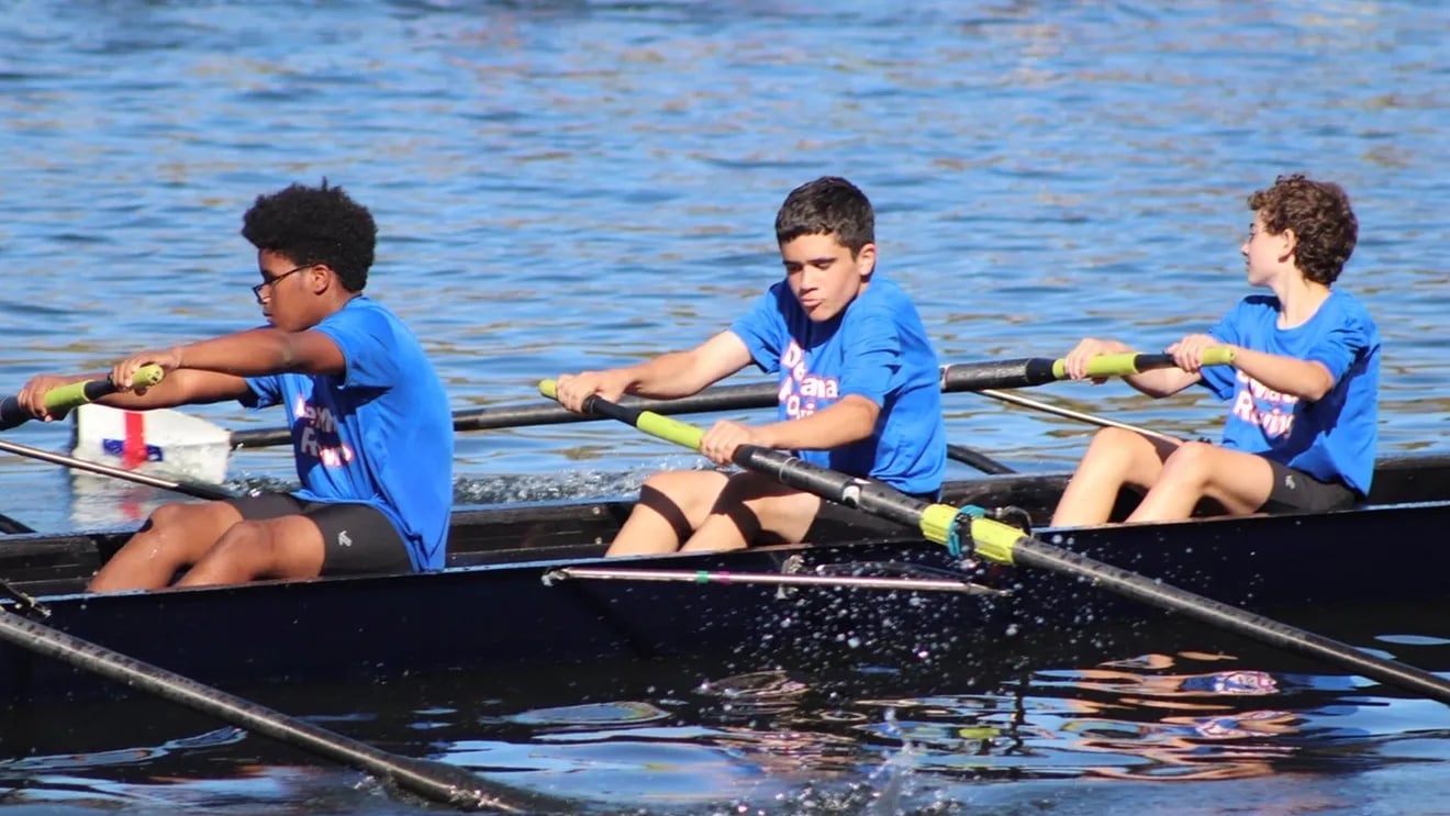 Colin rowing a boat