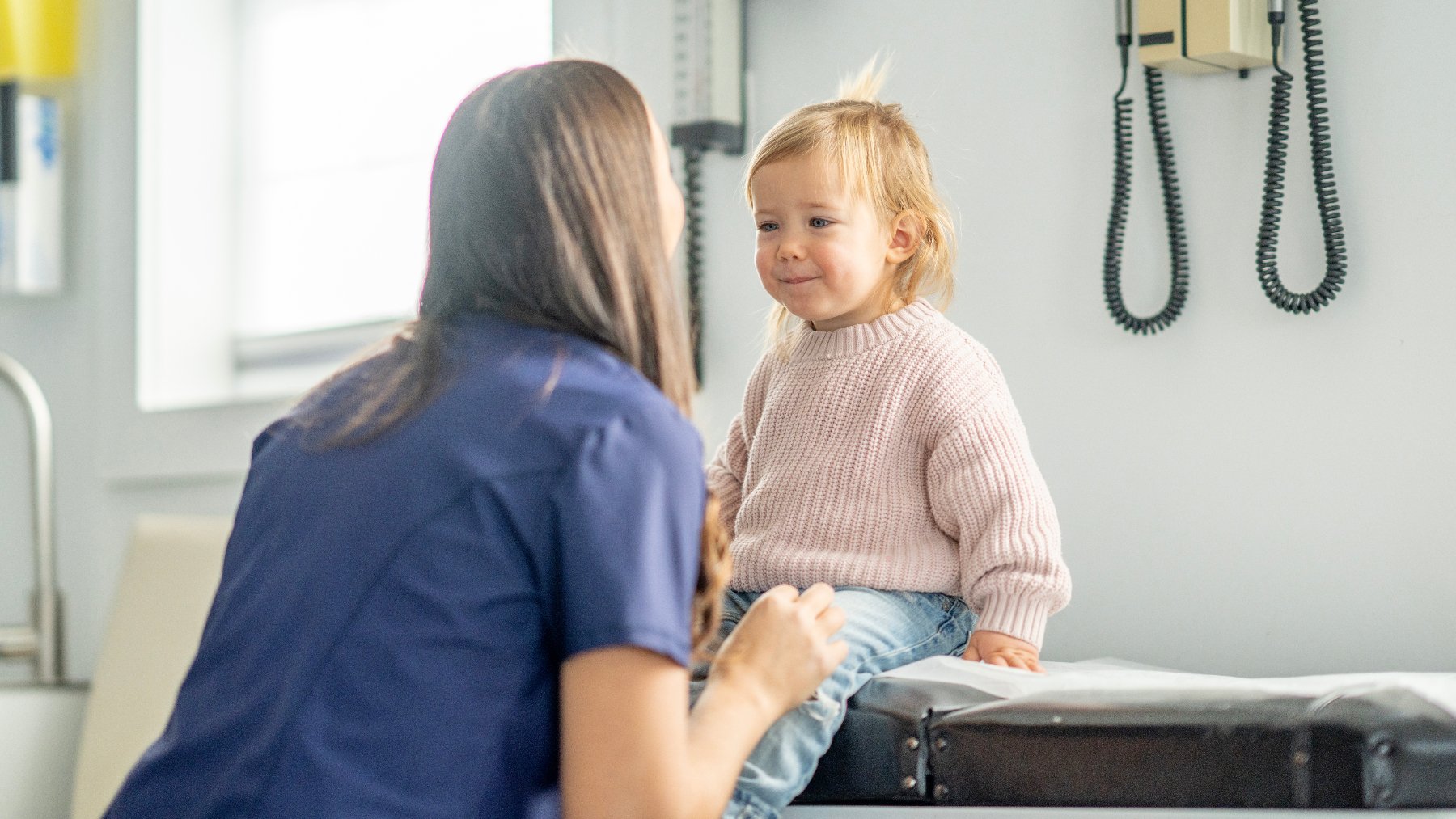 Young child interacting with provider