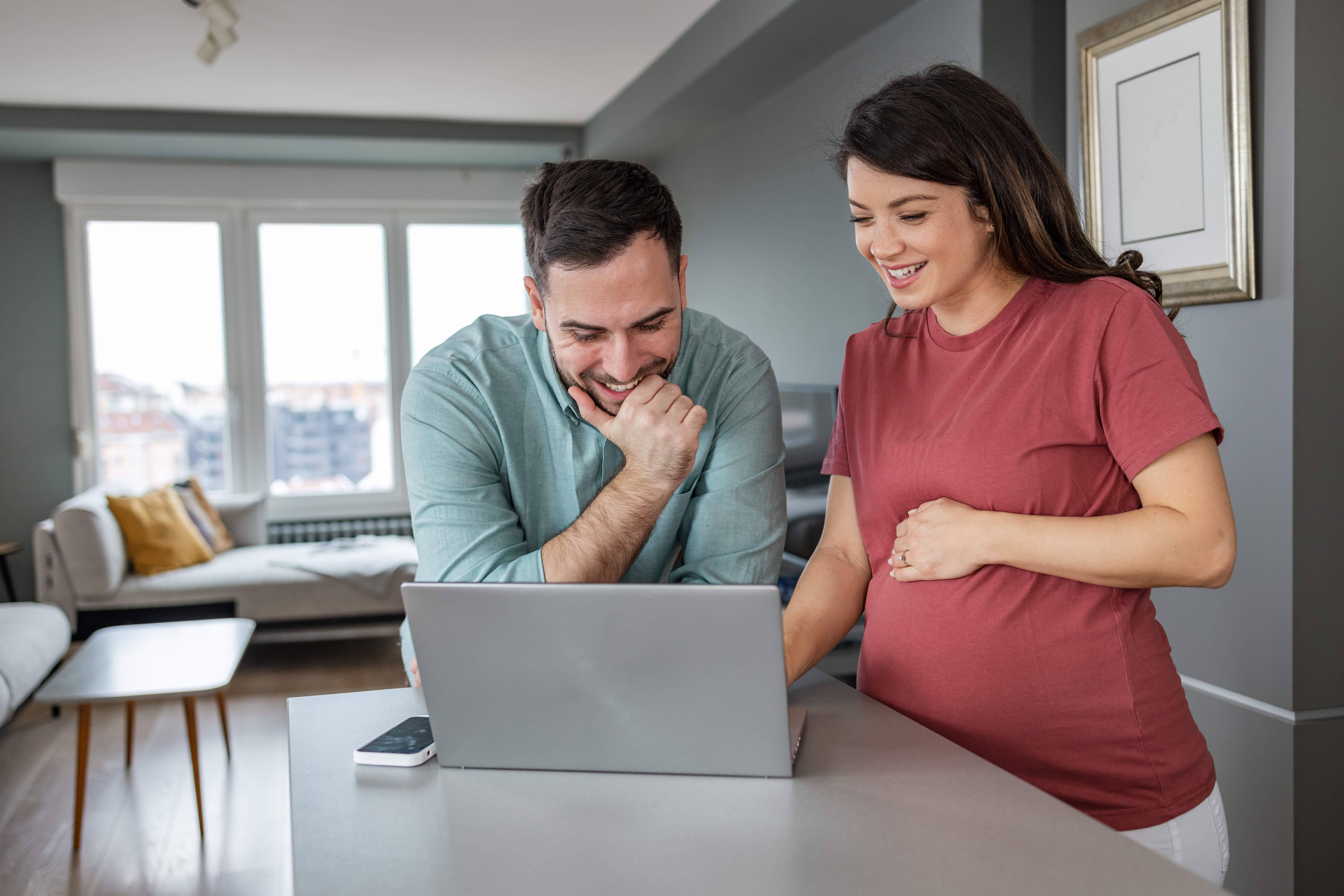 Soon to be parents watching a webinar