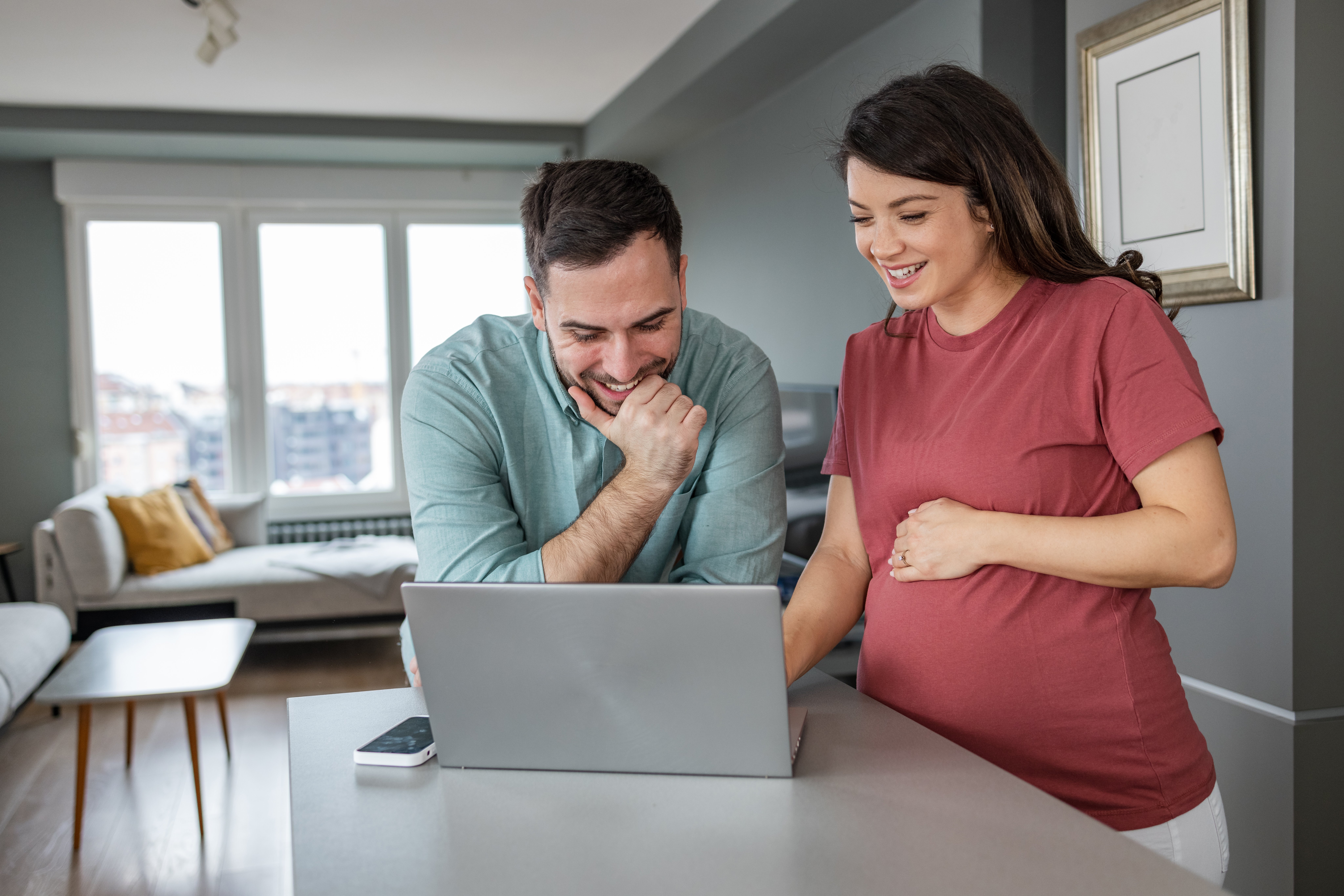 Soon to be parents watching a webinar