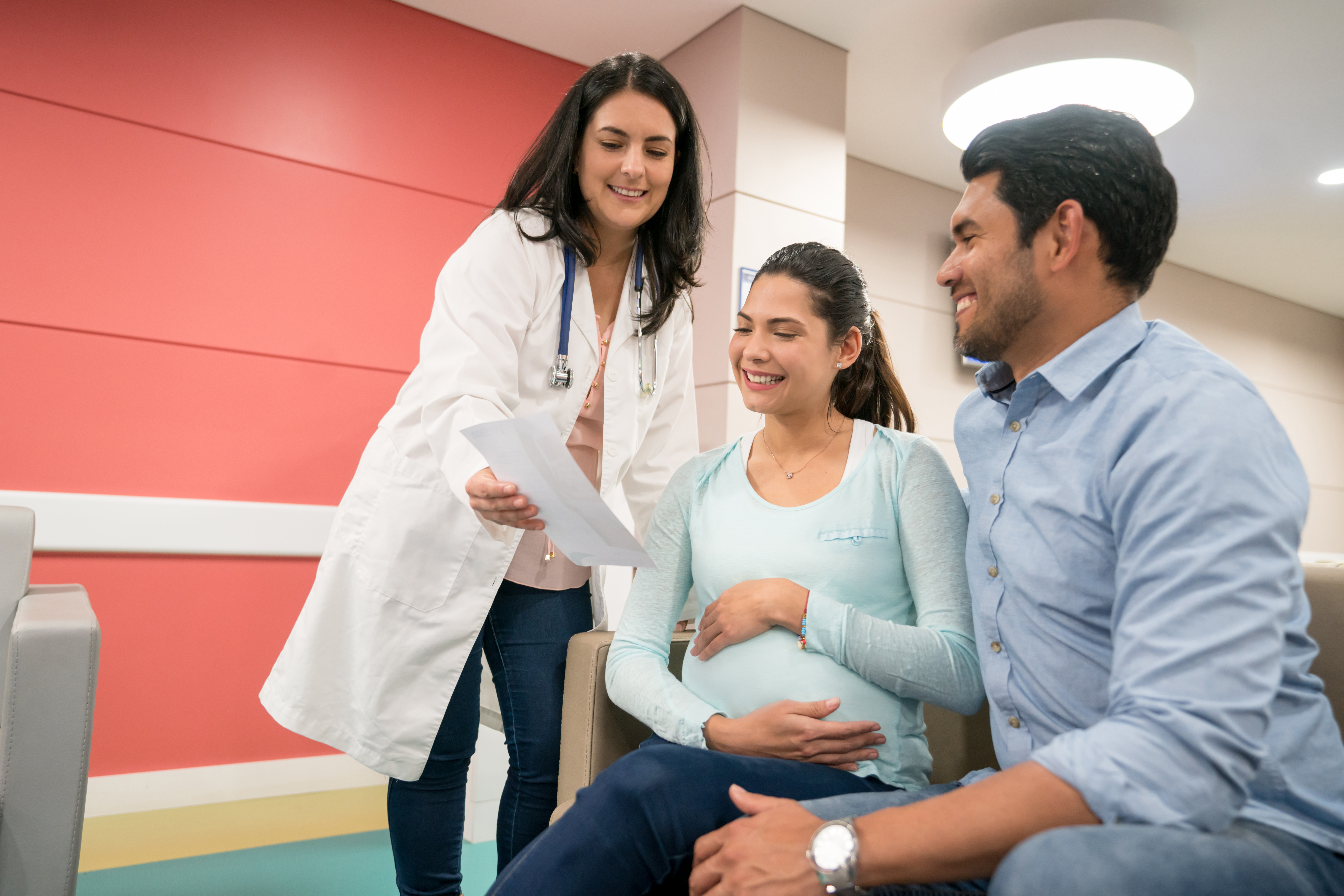 Soon to be parents meeting with a pediatrician