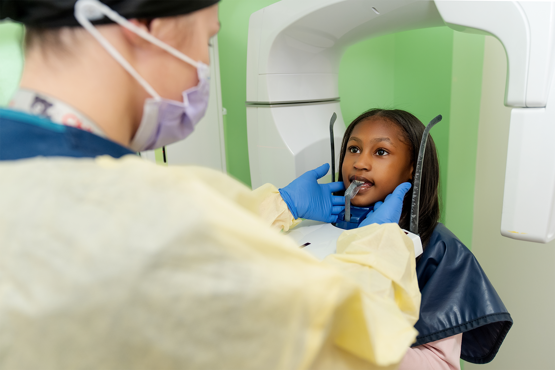 Pre-teen patient getting an x-ray
