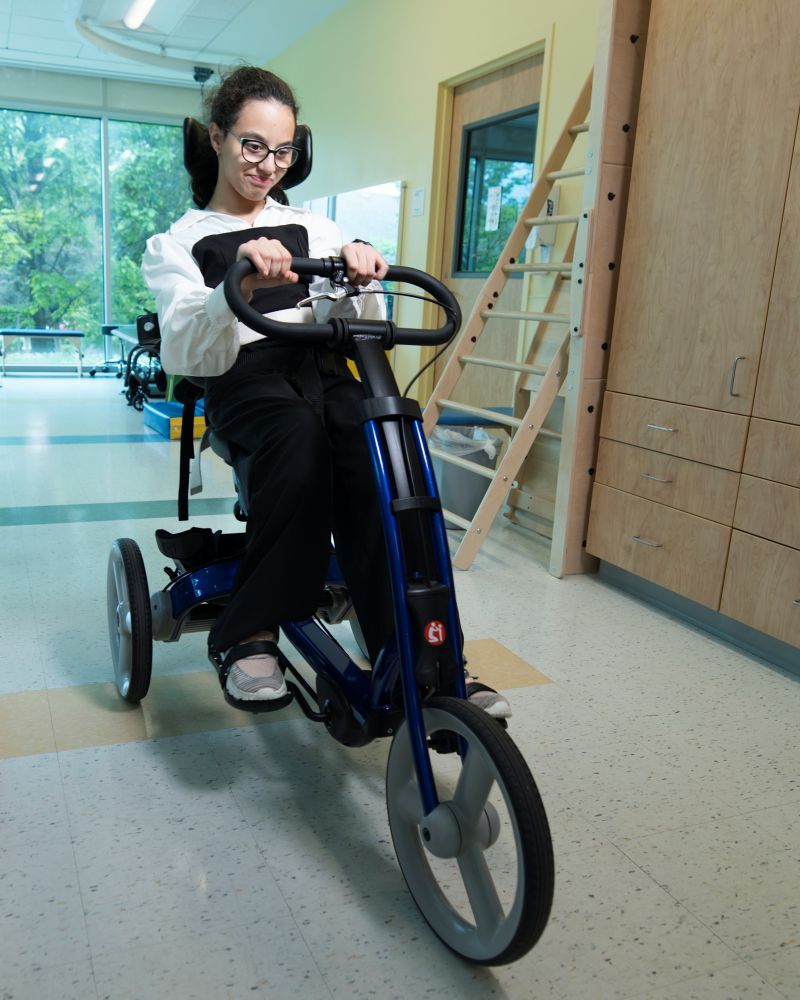 Young patient cycling in therapy