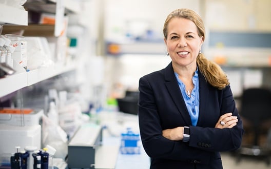 Catherine Bollard, MD, MBChB in a lab