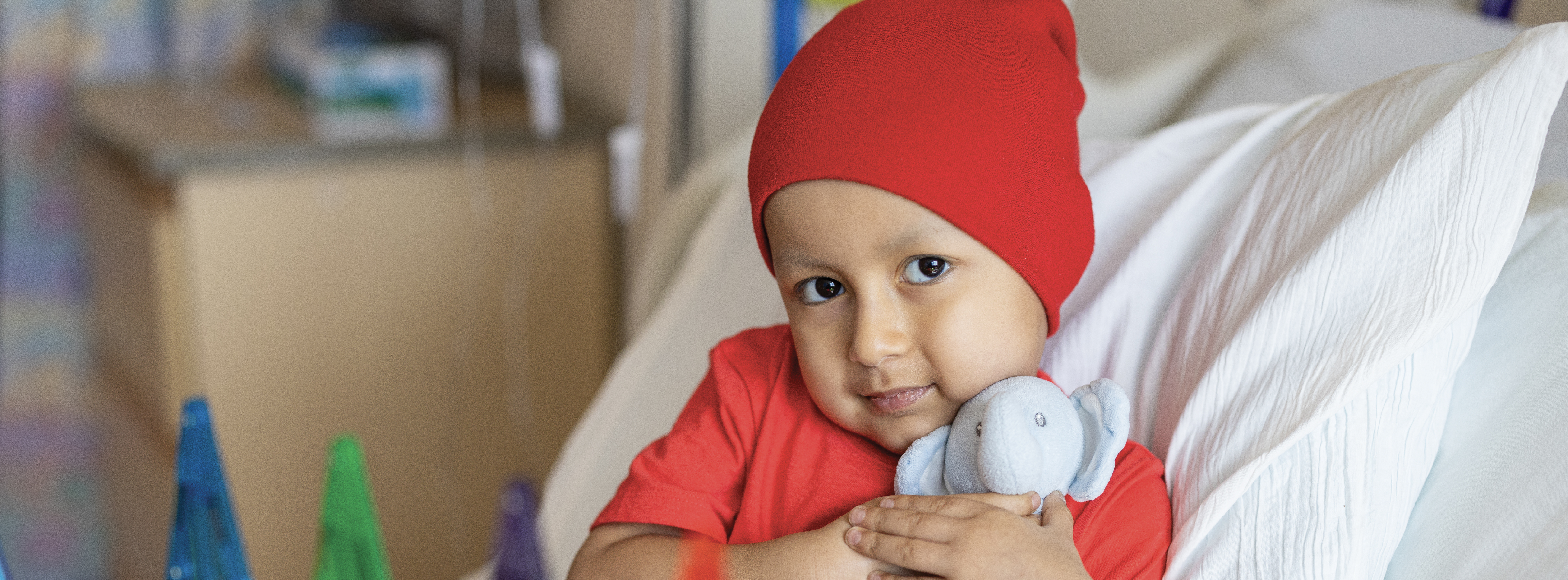 young patient hugging a toy