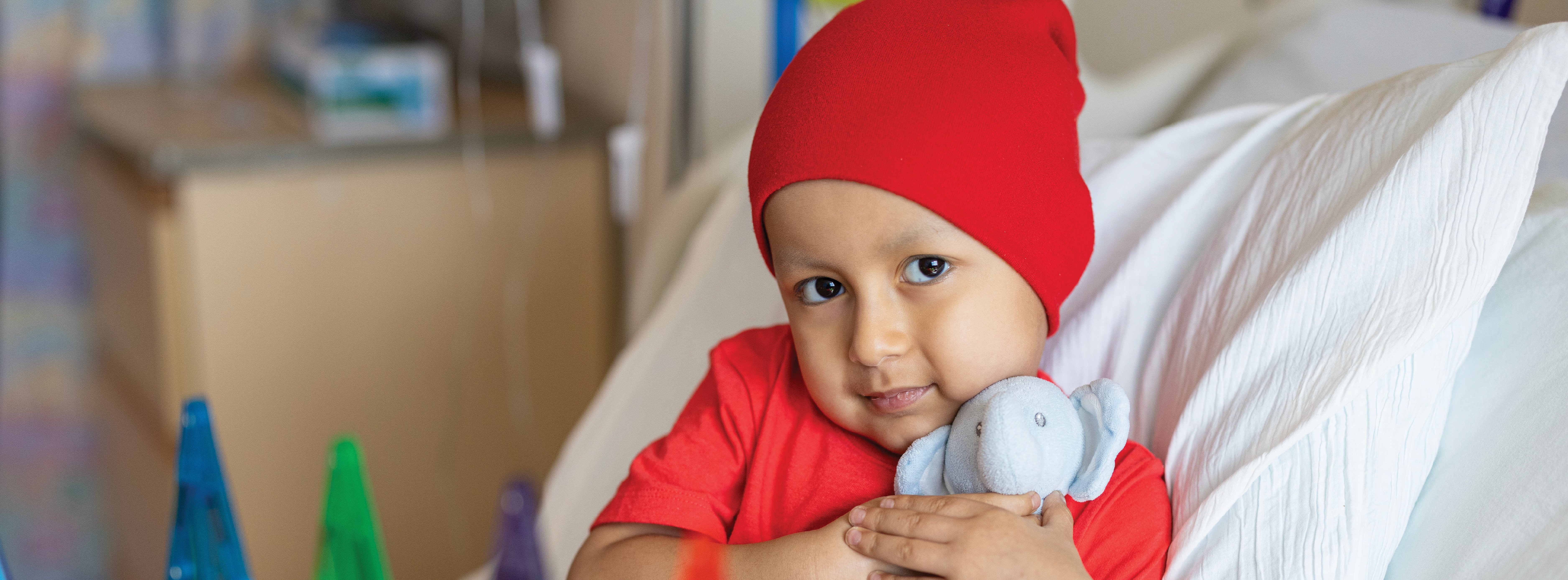 young patient hugging a toy
