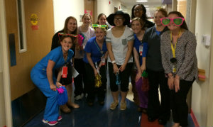 Carly and her Children's National care staff smile for the camera