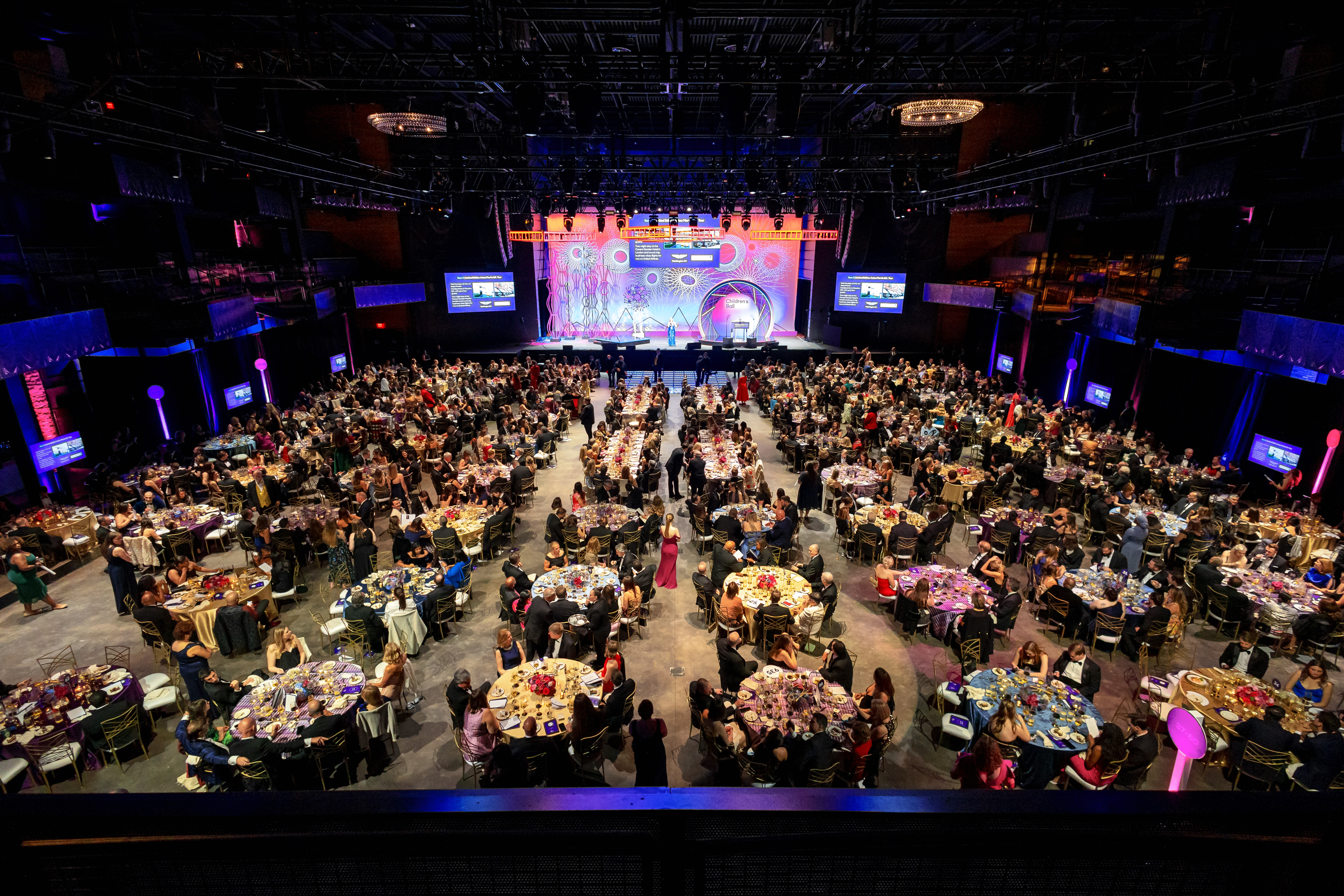 A bird's eye view of event attendees seated throughout the Anthem venue at the Children's Ball 2026.