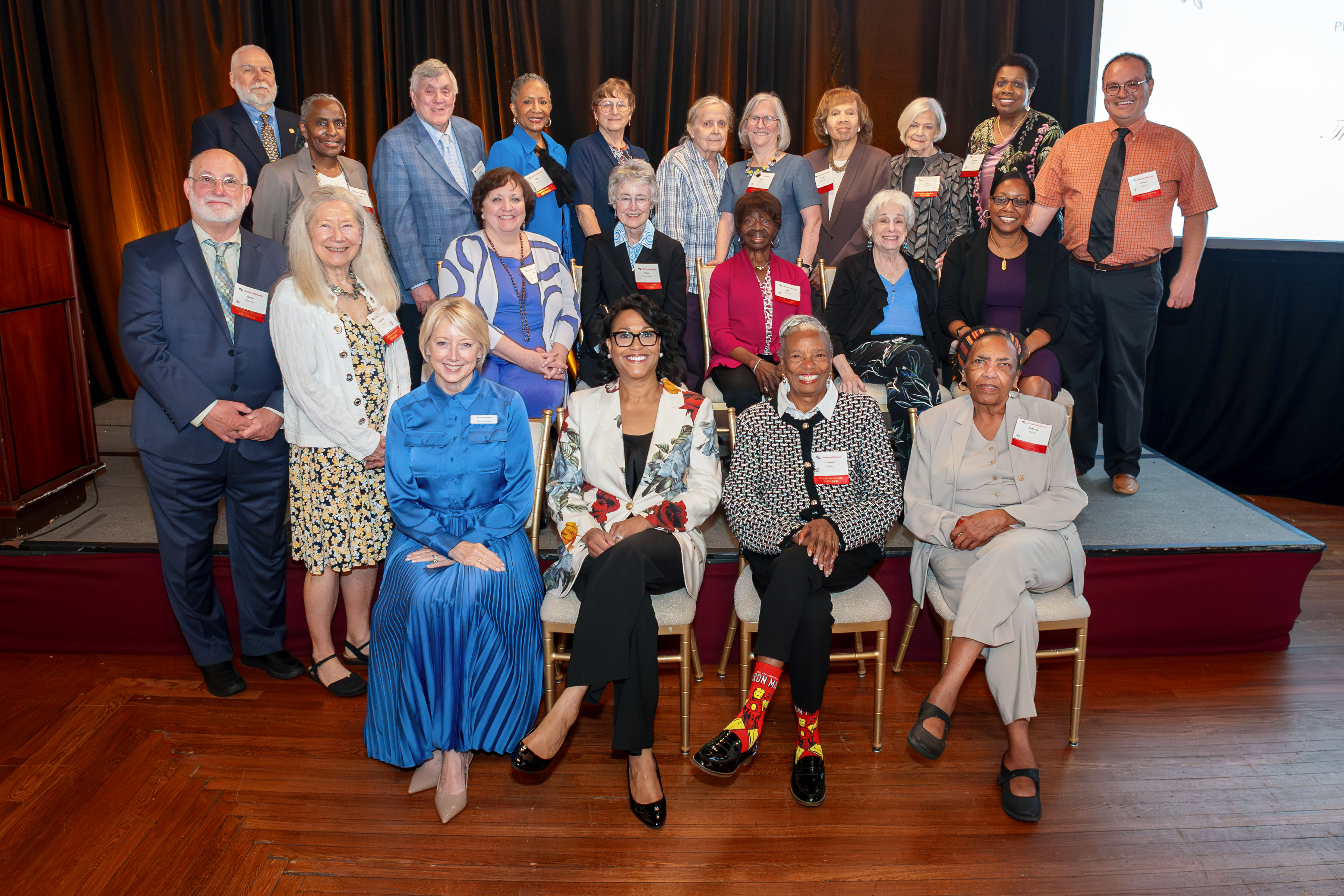 Guardian Society members pose for a group photo with Children's National President and CEO, Michelle Riley-Brown, at the 2026 luncheon.