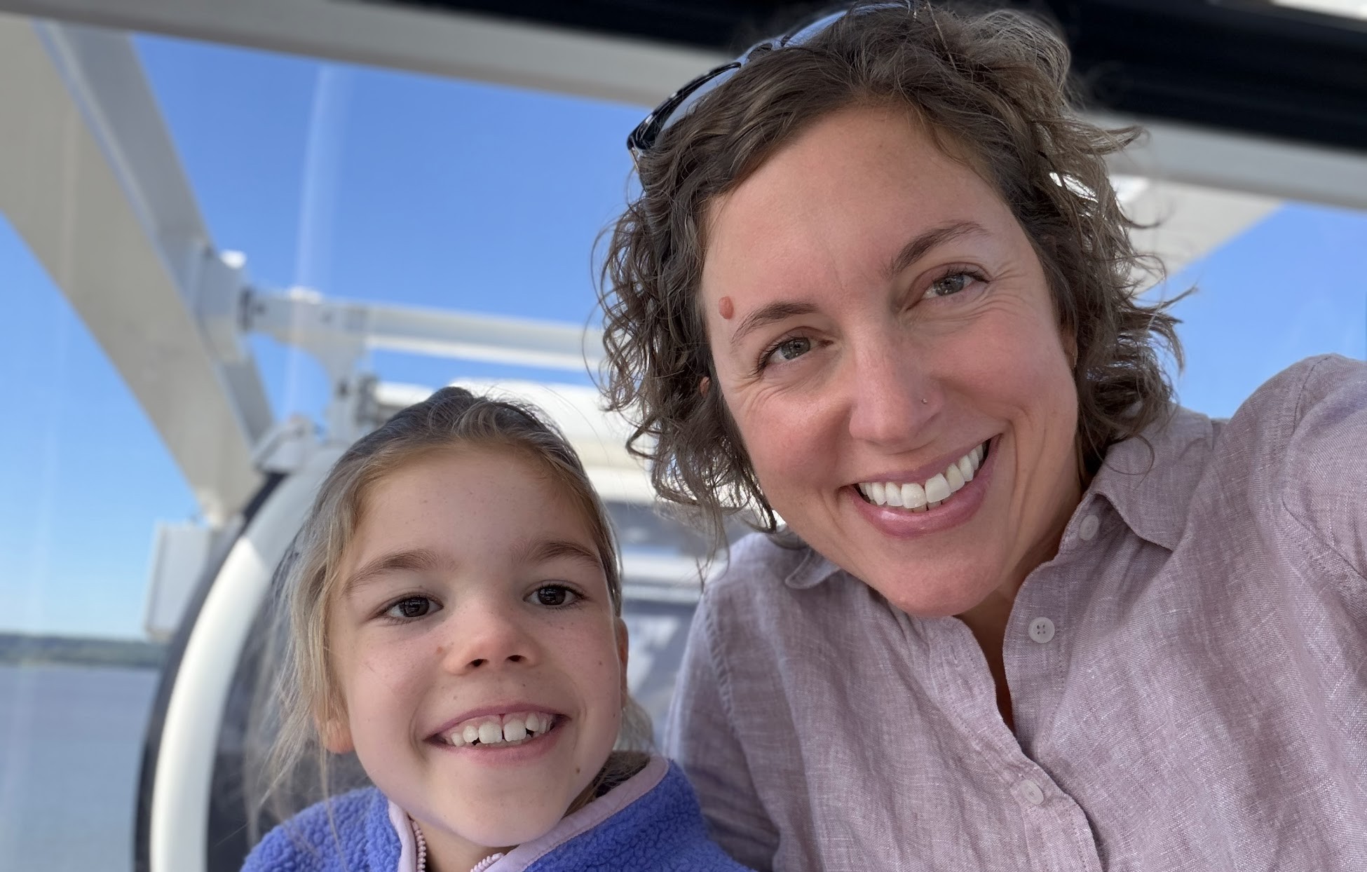 Alice and her mother smiling together.
