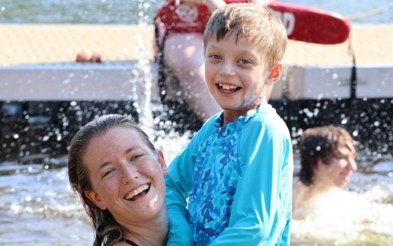 Children's National Hospital nurse, Margaret Gill, enjoying a pool session with patient Braden.