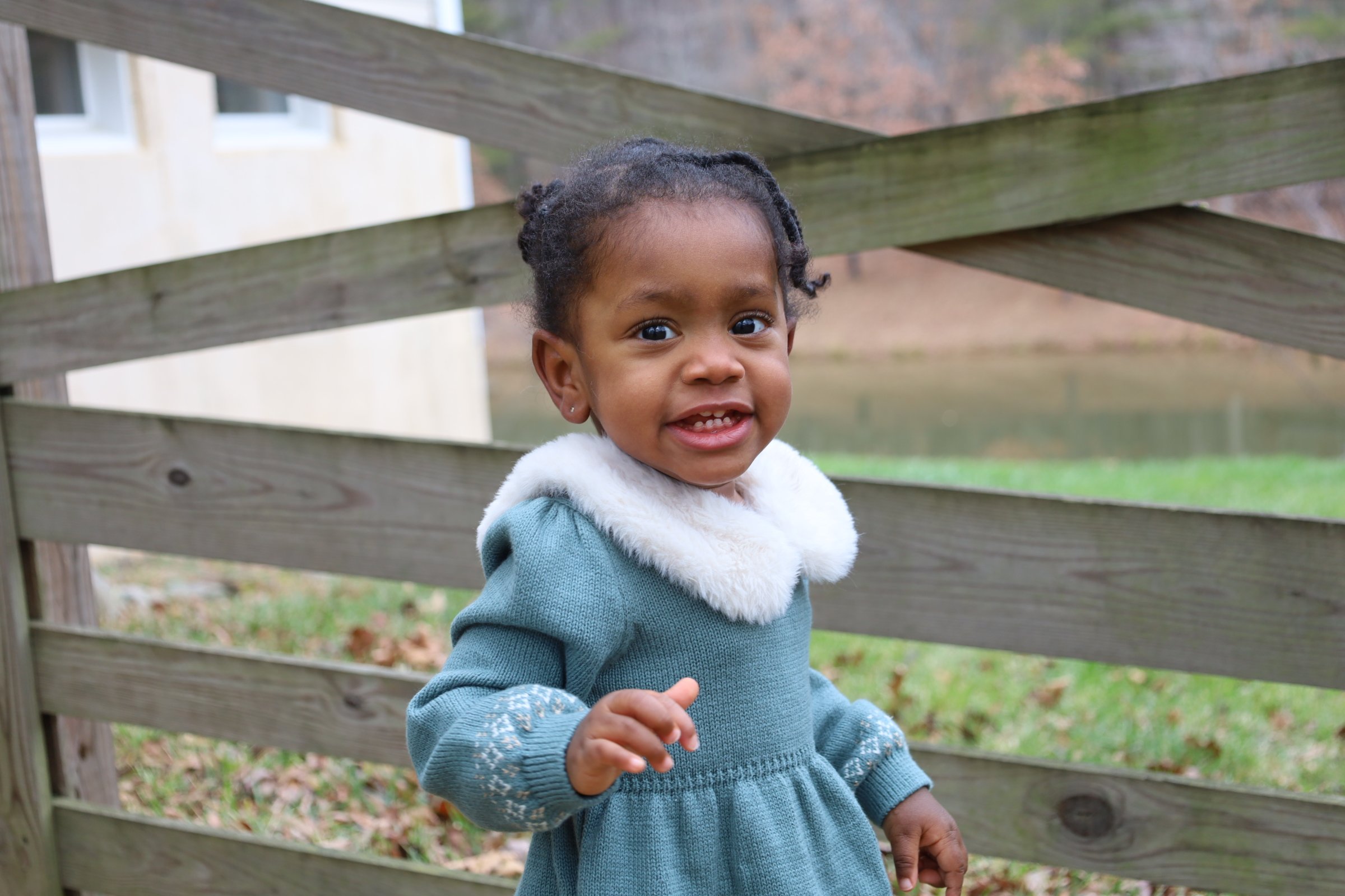 Melaina smiling as a toddler.