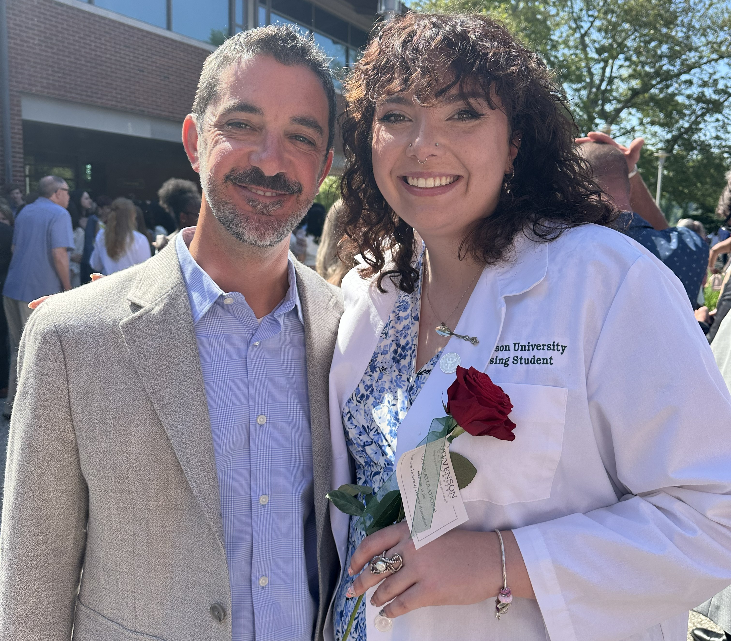 Children's National patient, Rachel, with Dr. Marc DiSabella at her graduation from nursing school.